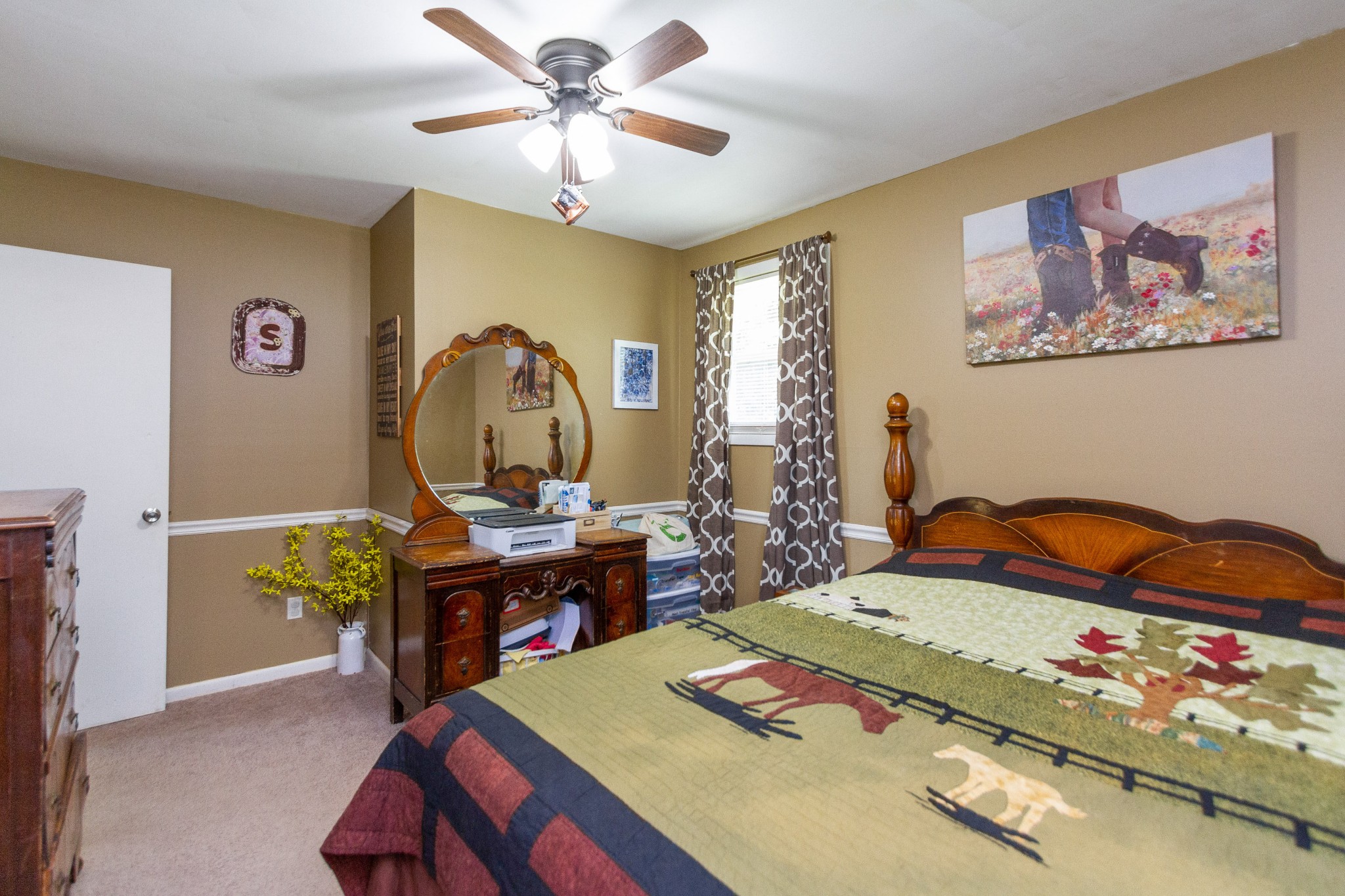 1940 Austin Road Lafayette, TN 37083 - Photo 23 of 41 a bedroom with a bed and a chandelier