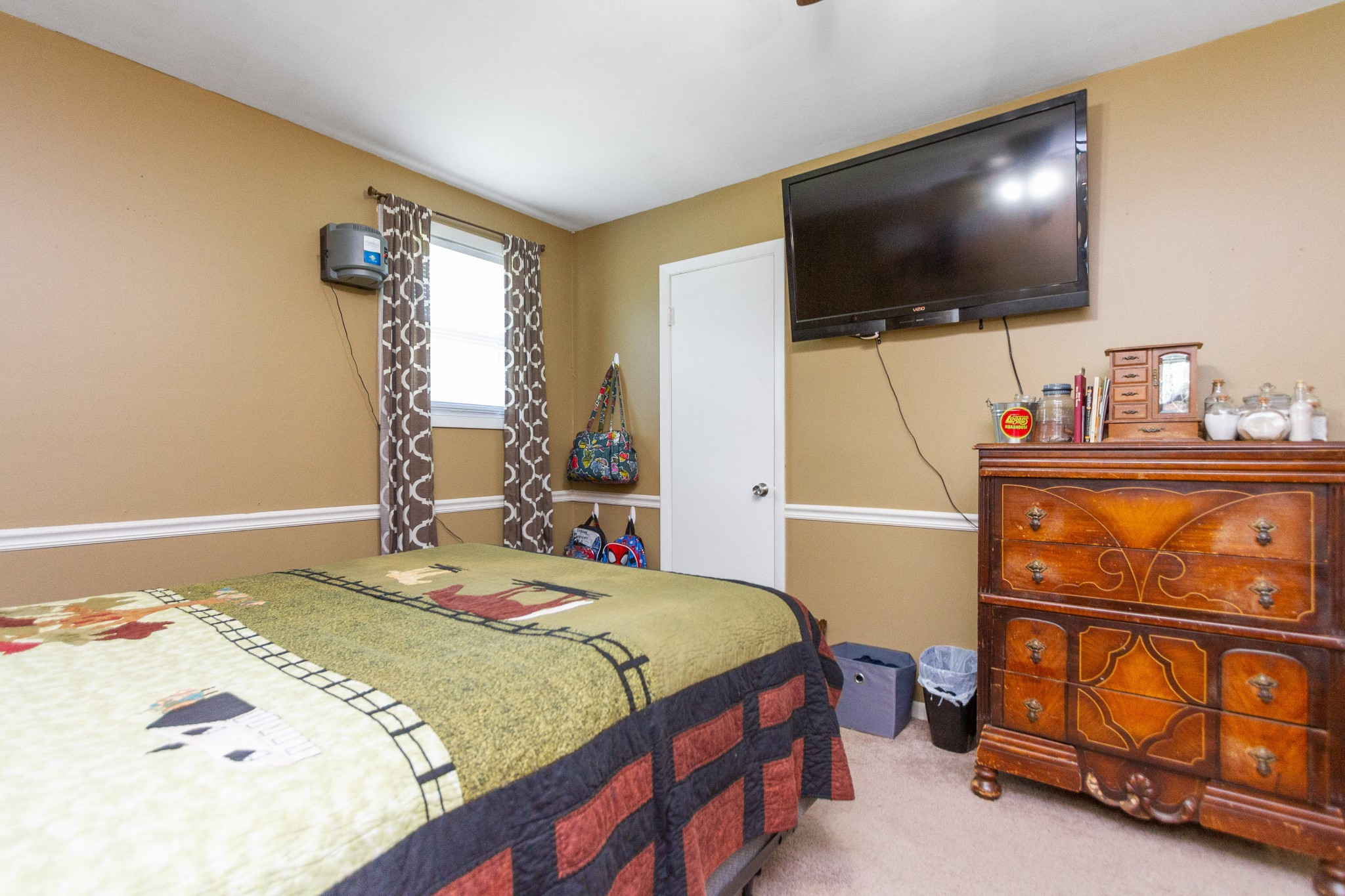 1940 Austin Road Lafayette, TN 37083 - Photo 25 of 41 a bedroom with a bed and a flat screen tv