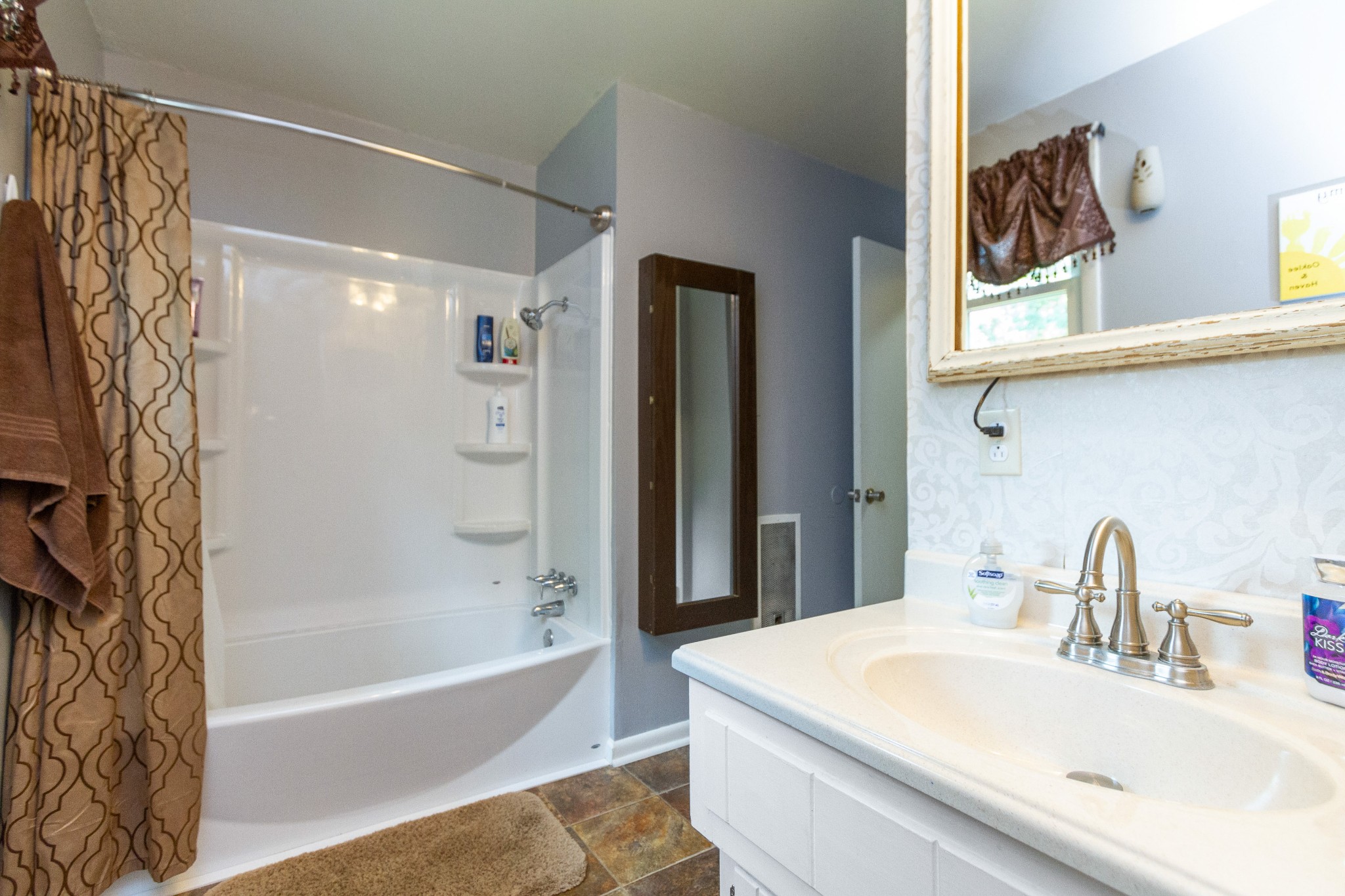 1940 Austin Road Lafayette, TN 37083 - Photo 28 of 41 a bathroom with a sink and a bathtub