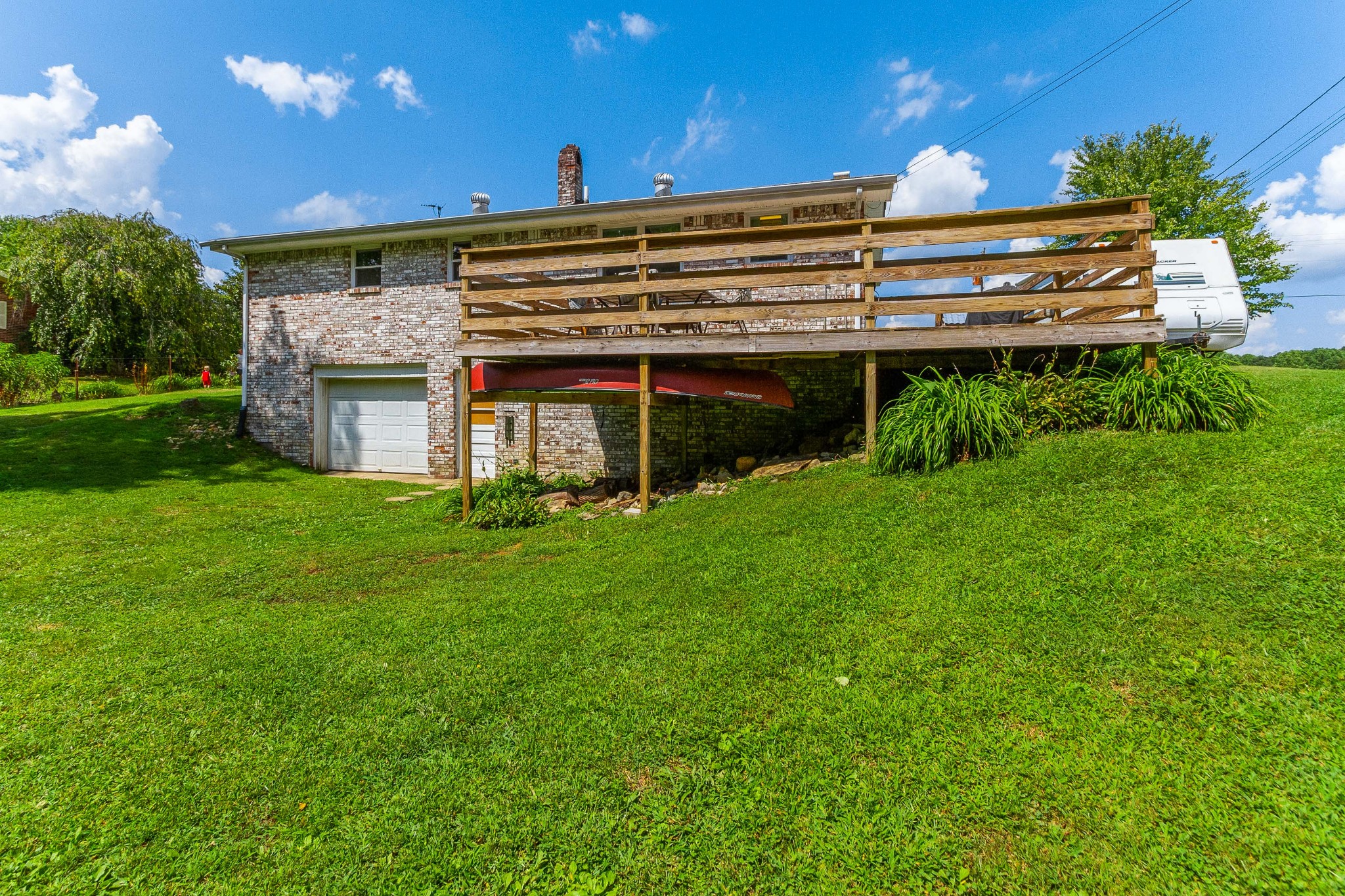 1940 Austin Road Lafayette, TN 37083 - Photo 10 of 41 a view of a house with a backyard and a pool