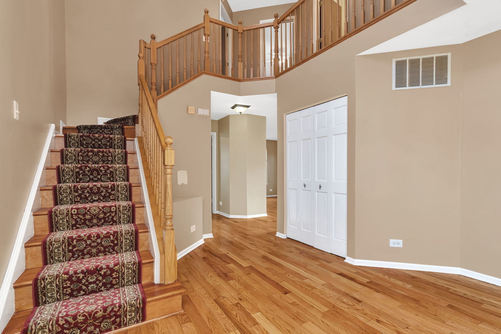 2509 Rosehall Lane Aurora, IL 60503 - Photo 3 of 51 a view of a bedroom with wooden floor and windows