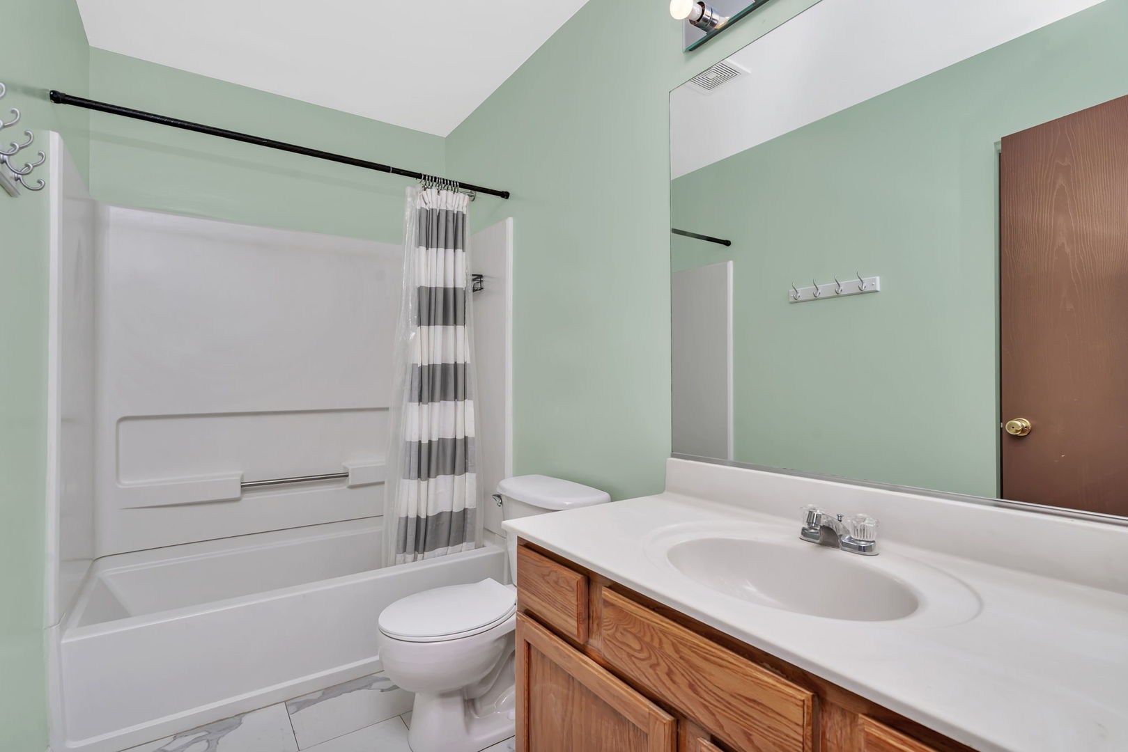 2509 Rosehall Lane Aurora, IL 60503 - Photo 32 of 51 a bathroom with a sink a toilet and shower