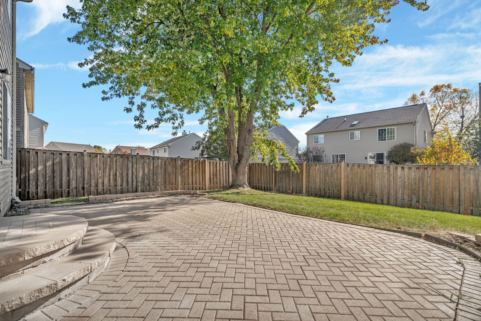 2509 Rosehall Lane Aurora, IL 60503 - Photo 42 of 51 a street view with wooden fence