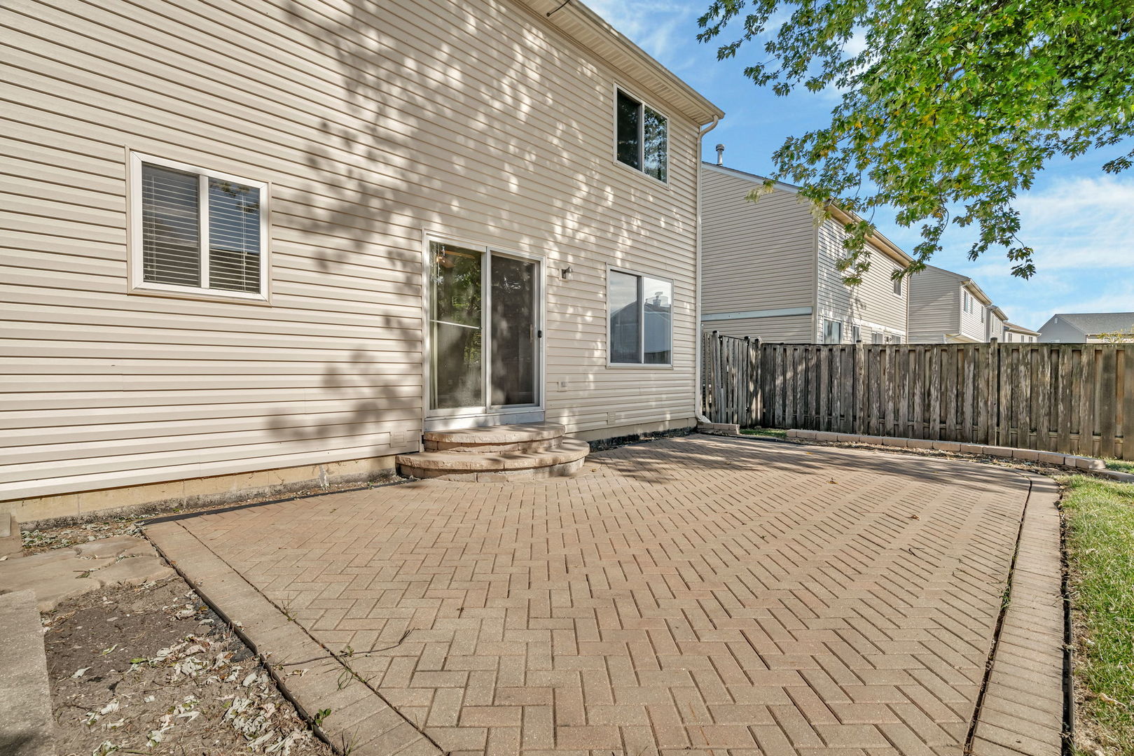 2509 Rosehall Lane Aurora, IL 60503 - Photo 47 of 51 a view of backyard with wooden fence and large trees