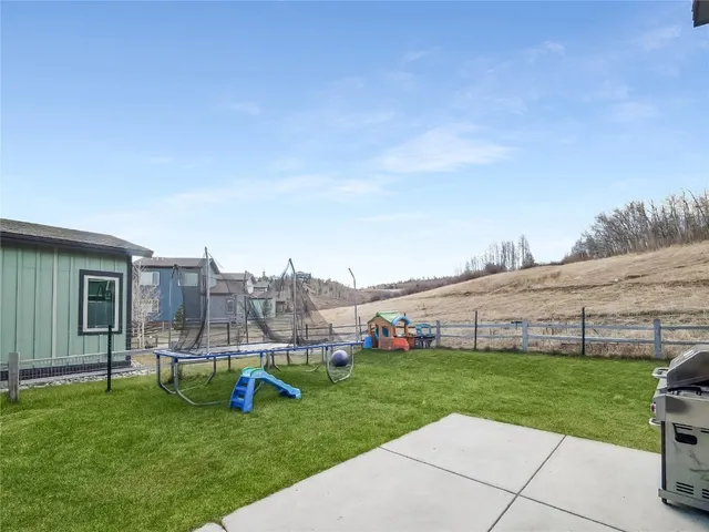 a view of a backyard with sitting area