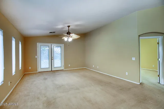 a view of a kitchen with a sink and cabinets