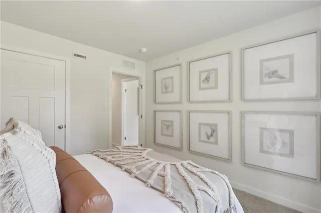 a spacious bathroom with a shower a sink and a mirror