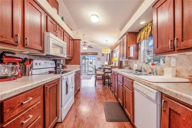 a kitchen with stainless steel appliances granite countertop lots of counter top space a sink and cabinets