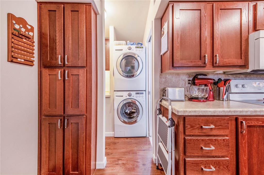178 Lily Creek Way Frostproof, FL 33843 - Photo 13 of 35 a view of a storage and utility room with washer and dryer