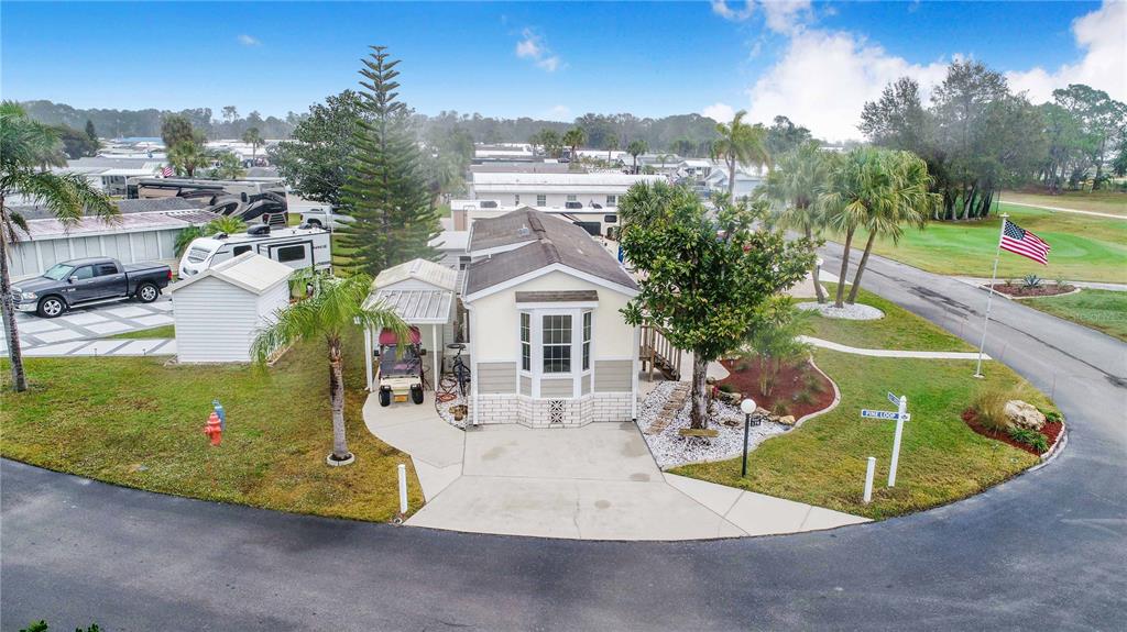178 Lily Creek Way Frostproof, FL 33843 - Photo 22 of 35 a view of a swimming pool with a slide and a fire pit