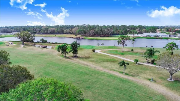 a view of a lake with a big yard