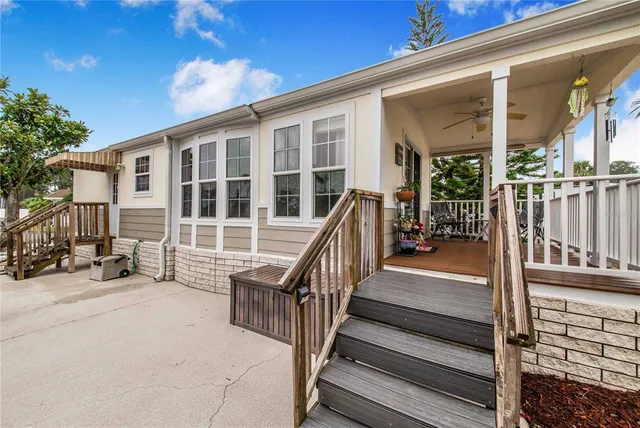 a view of a house with wooden floor and stairs