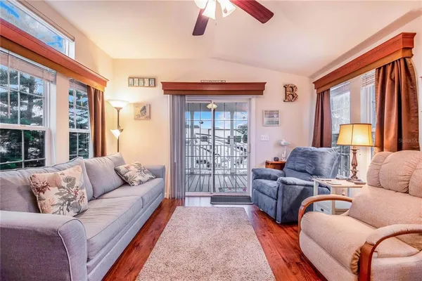 a living room with furniture or couch and a large window