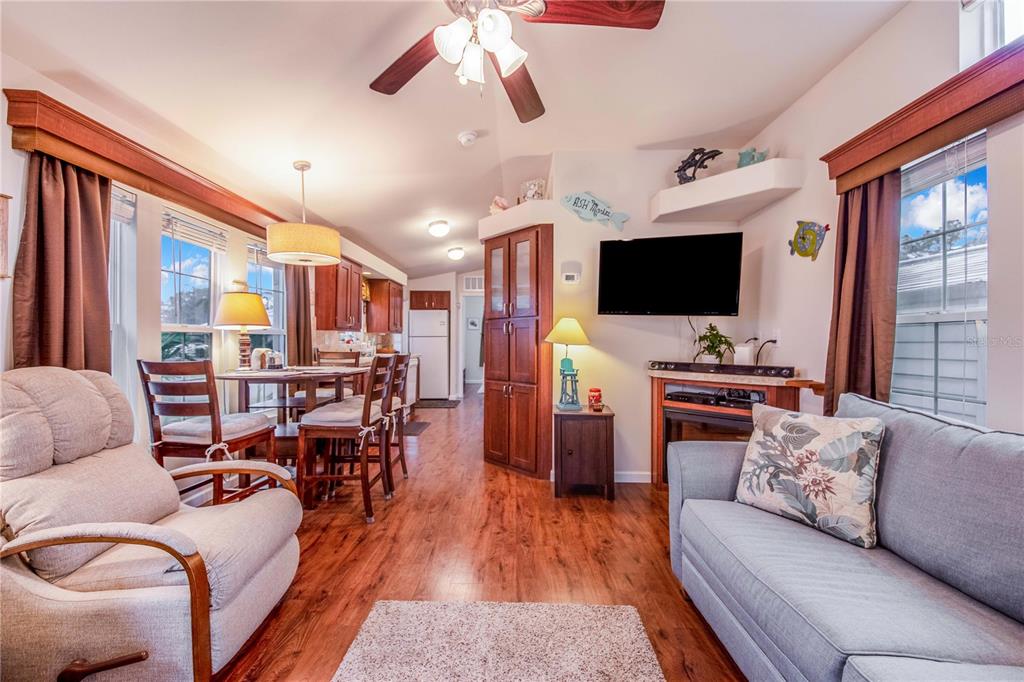 178 Lily Creek Way Frostproof, FL 33843 - Photo 10 of 35 a living room with furniture and a flat screen tv