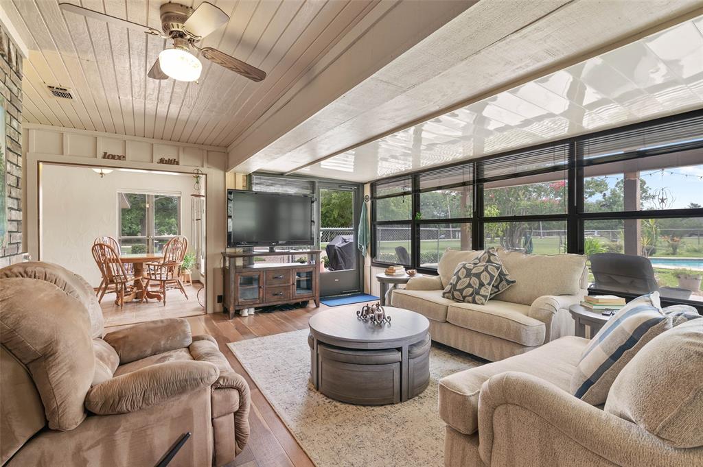 108 Carlin Road Mansfield, TX 76063 - Photo 12 of 40 a living room with furniture or outdoor view and a potted plant