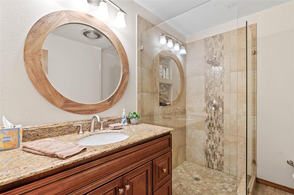108 Carlin Road Mansfield, TX 76063 - Photo 15 of 40 a bathroom with a granite countertop sink a mirror and shower