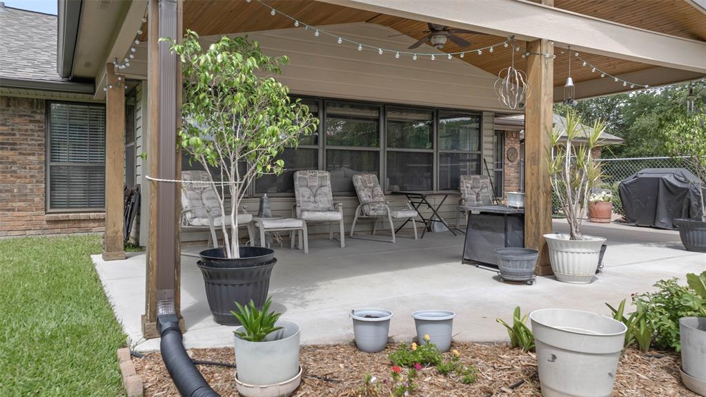 108 Carlin Road Mansfield, TX 76063 - Photo 18 of 40 a view of a patio with chairs and potted plants