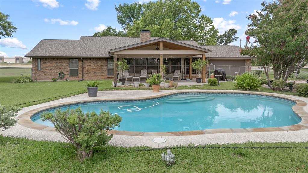 108 Carlin Road Mansfield, TX 76063 - Photo 2 of 40 a front view of a house with garden