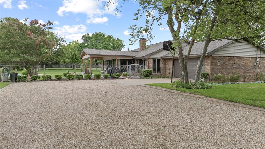108 Carlin Road Mansfield, TX 76063 - Photo 21 of 40 a front view of house with yard and green space
