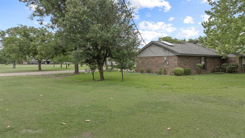 108 Carlin Road Mansfield, TX 76063 - Photo 22 of 40 a front view of a house with a yard