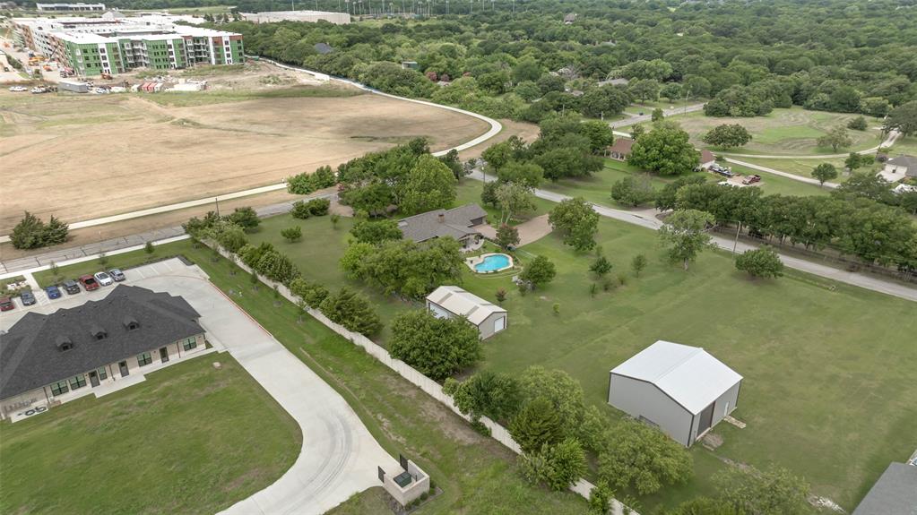 108 Carlin Road Mansfield, TX 76063 - Photo 25 of 40 a view of a swimming pool with a yard