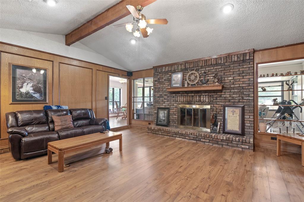 108 Carlin Road Mansfield, TX 76063 - Photo 3 of 40 a living room with furniture and a fireplace