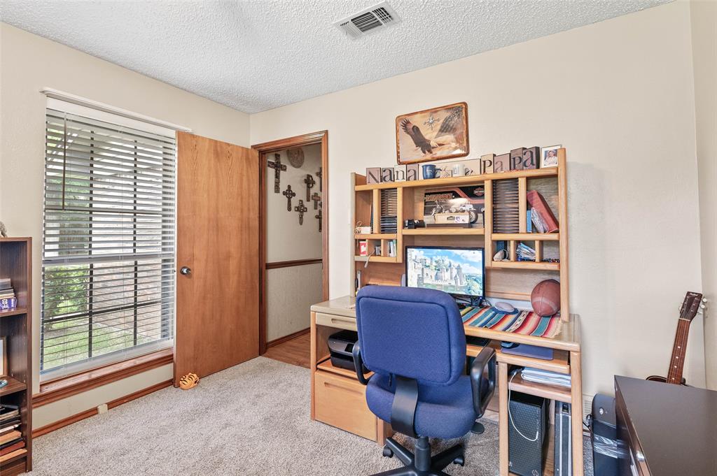 108 Carlin Road Mansfield, TX 76063 - Photo 35 of 40 a view of a workspace with furniture and a window