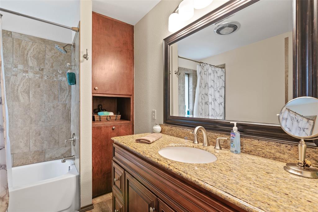 108 Carlin Road Mansfield, TX 76063 - Photo 36 of 40 a bathroom with a granite countertop sink and a mirror