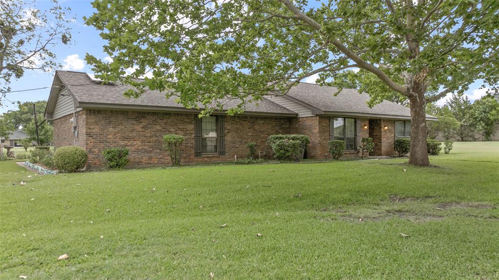 108 Carlin Road Mansfield, TX 76063 - Photo 40 of 40 a front view of a house with a garden