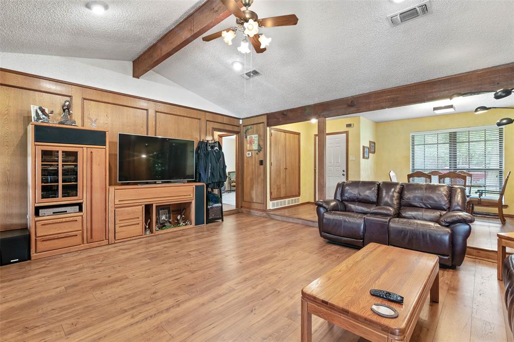 108 Carlin Road Mansfield, TX 76063 - Photo 7 of 40 a living room with furniture and a flat screen tv