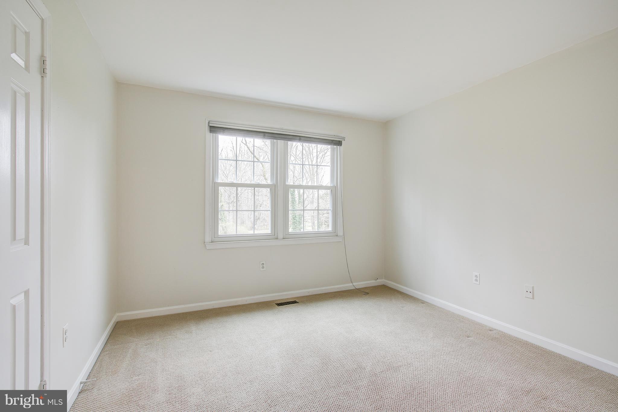 1030 Windrush Lane, Unit 31 Sandy Spring, MD 20860 - Photo 23 of 30 an empty room with a window
