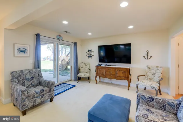 a view of a workspace with furniture and window