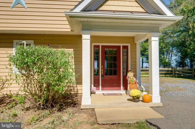 a view of a backyard with swimming pool