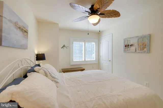 a view of a swimming pool with a table and chairs