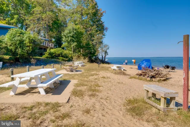 a view of a house with a porch and furniture