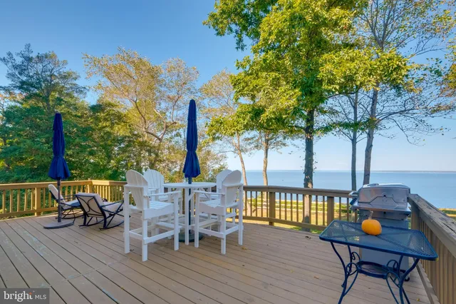 a view of a room with furniture and wooden floor