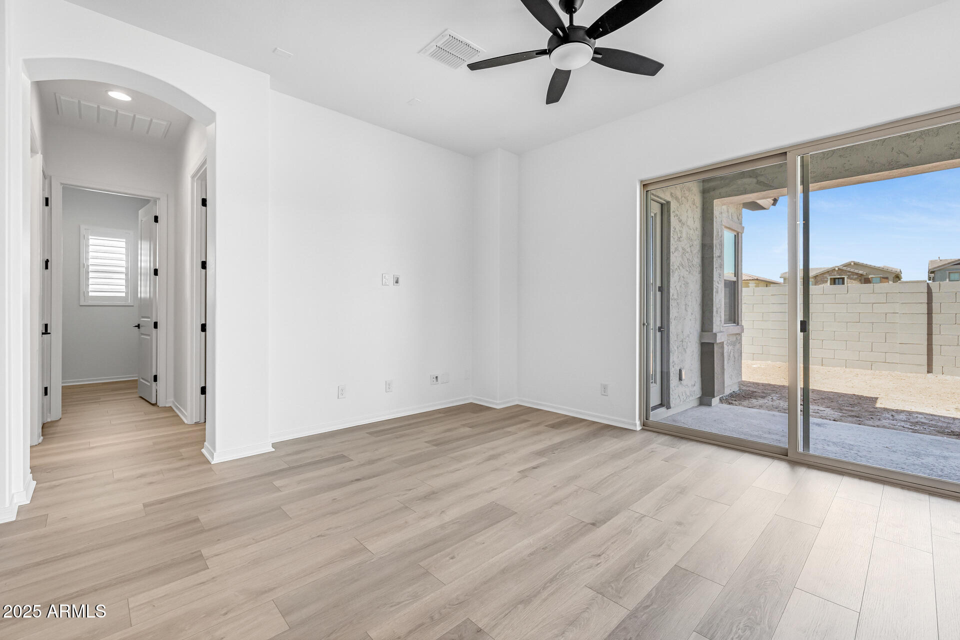 4252 East Bernice Street Gilbert, AZ 85295 - Photo 12 of 72 a view of a livingroom with a ceiling fan & wooden floor