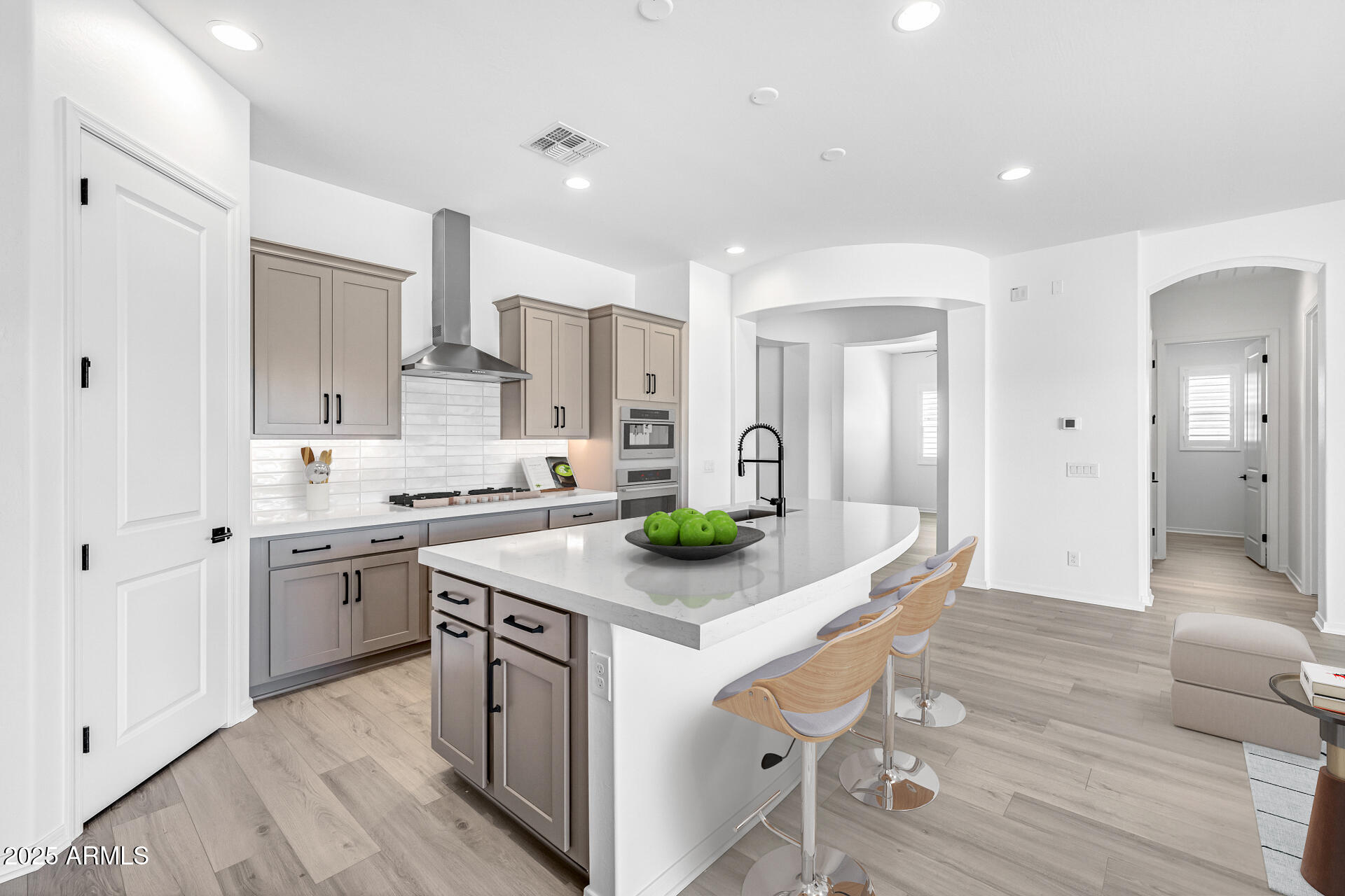 4252 East Bernice Street Gilbert, AZ 85295 - Photo 20 of 72 a kitchen with stainless steel appliances granite countertop a white cabinets and wooden floor