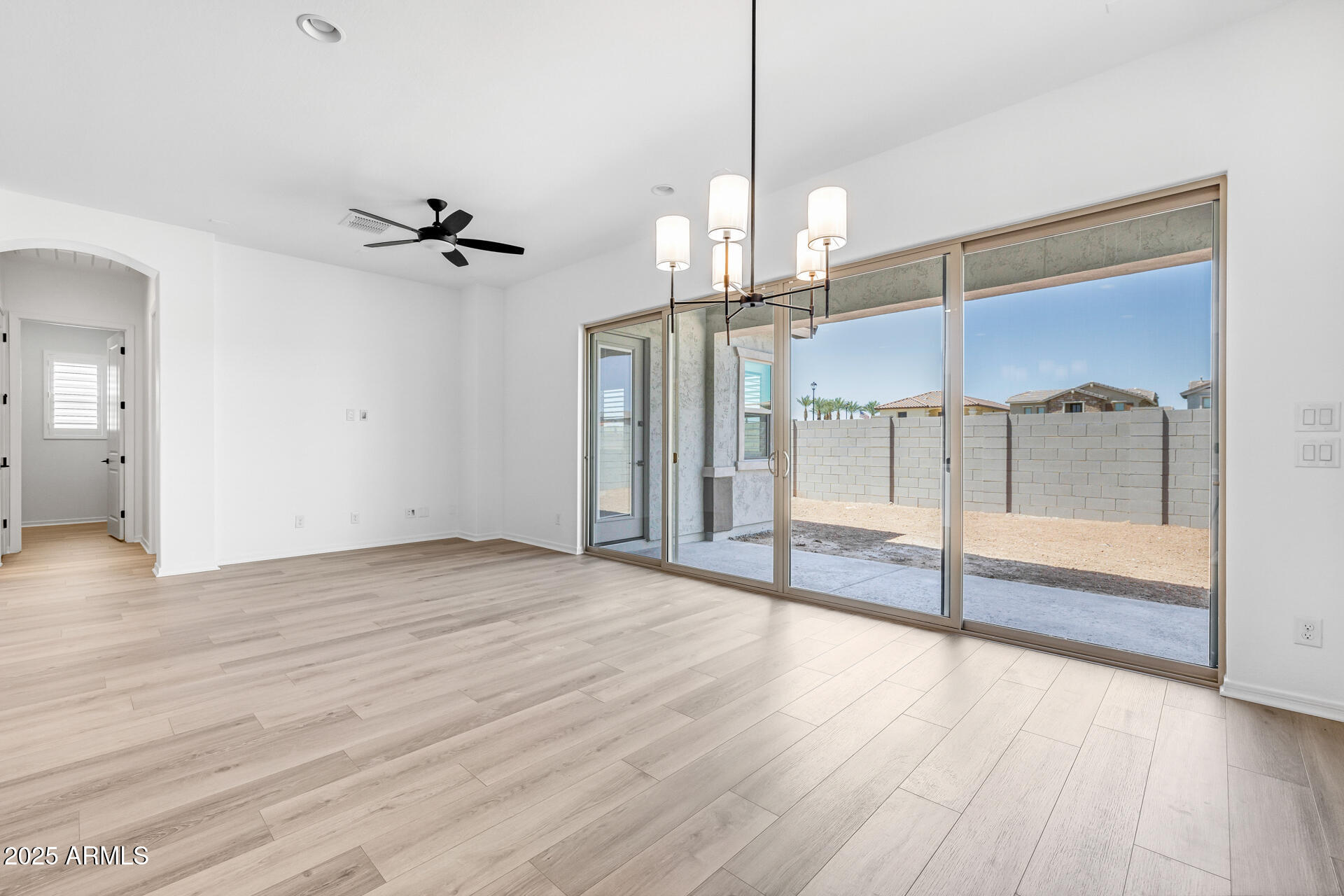 4252 East Bernice Street Gilbert, AZ 85295 - Photo 21 of 72 a view of empty room with wooden floor and fan