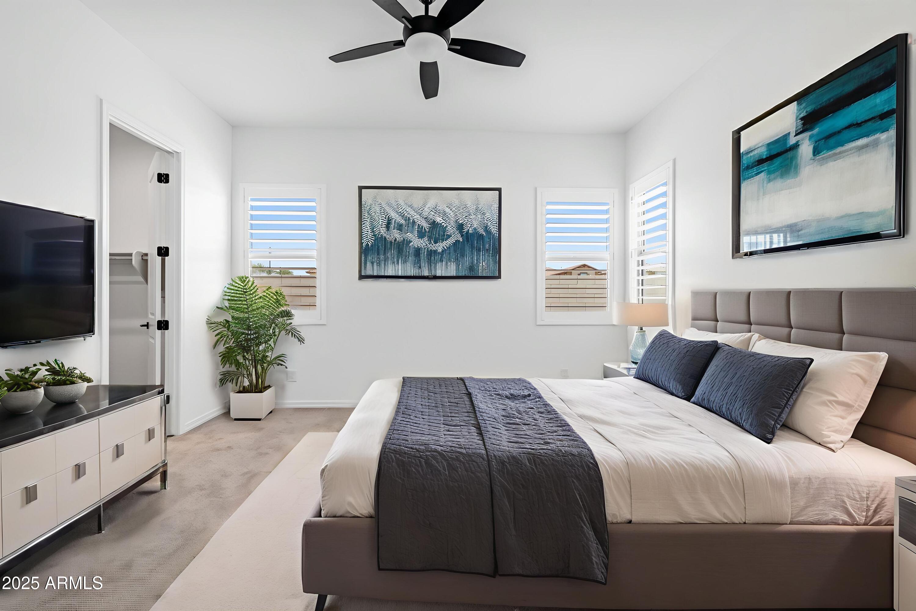 4252 East Bernice Street Gilbert, AZ 85295 - Photo 28 of 72 a bedroom with a large bed and a flat tv screen on dresser