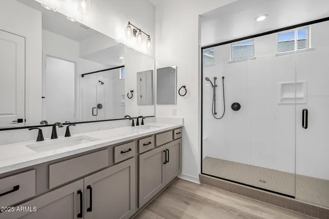 a bedroom with bed and wall painting