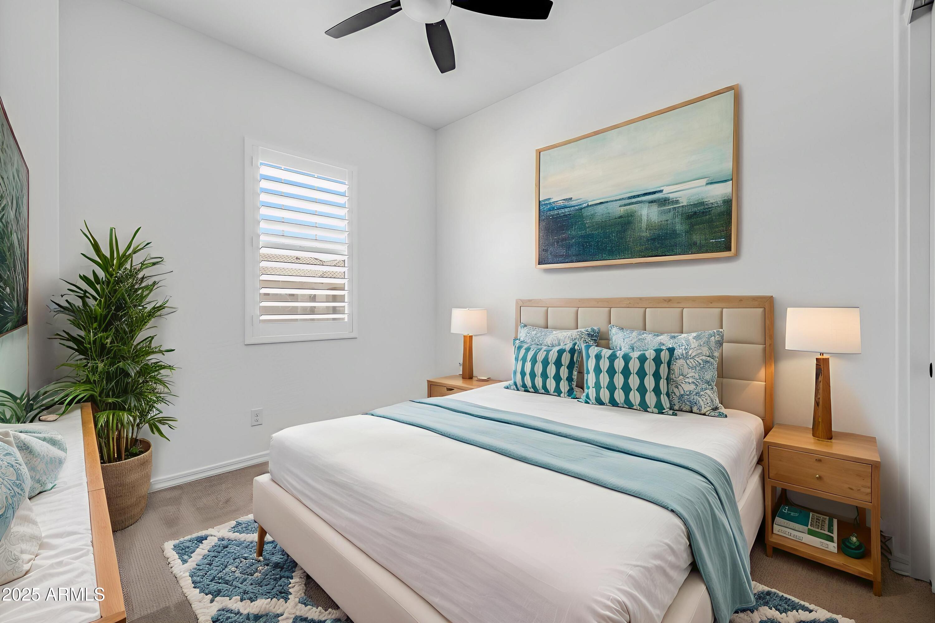 4252 East Bernice Street Gilbert, AZ 85295 - Photo 31 of 72 a bedroom with a bed and a potted plant