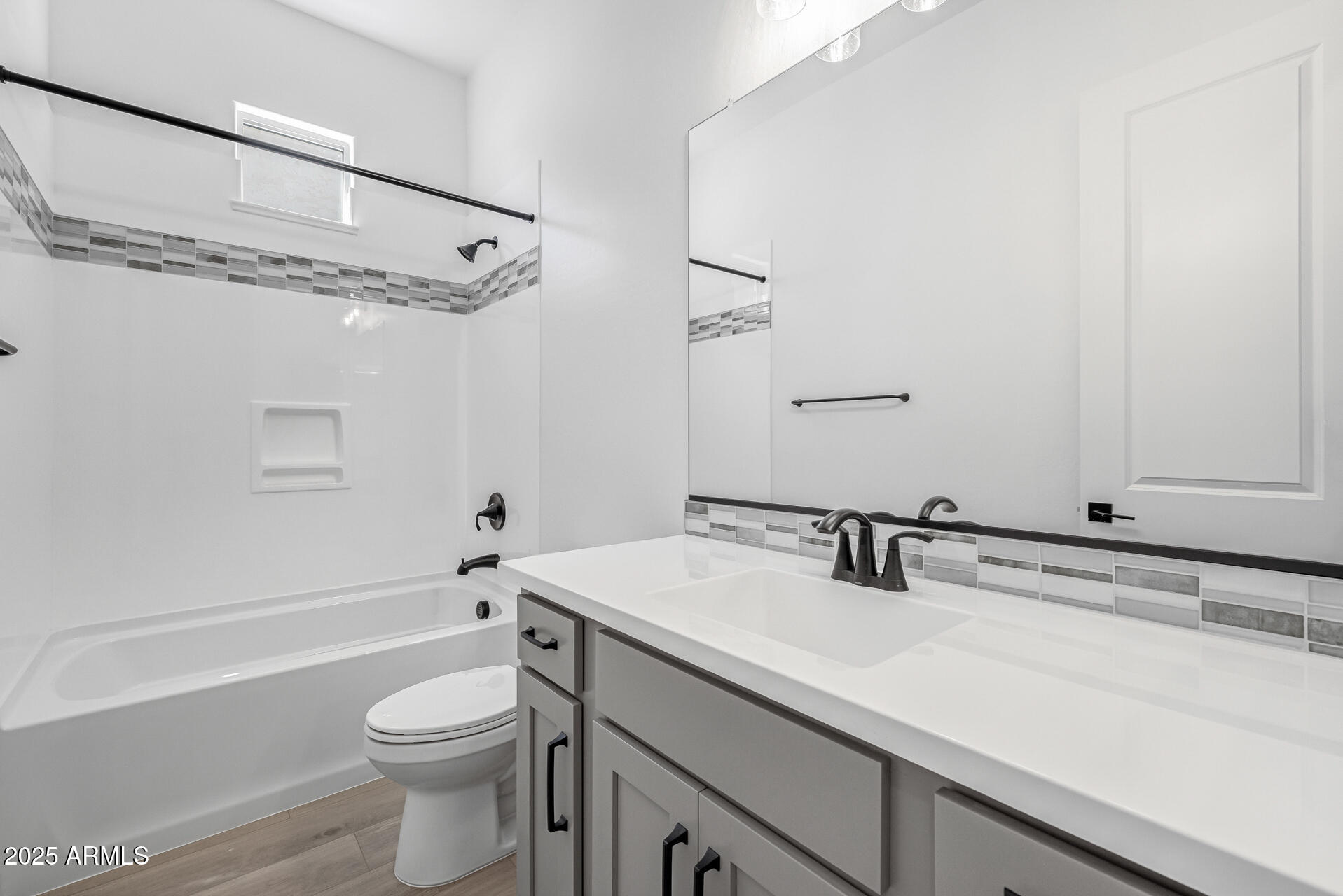 4252 East Bernice Street Gilbert, AZ 85295 - Photo 32 of 72 a bathroom with a sink a toilet and shower