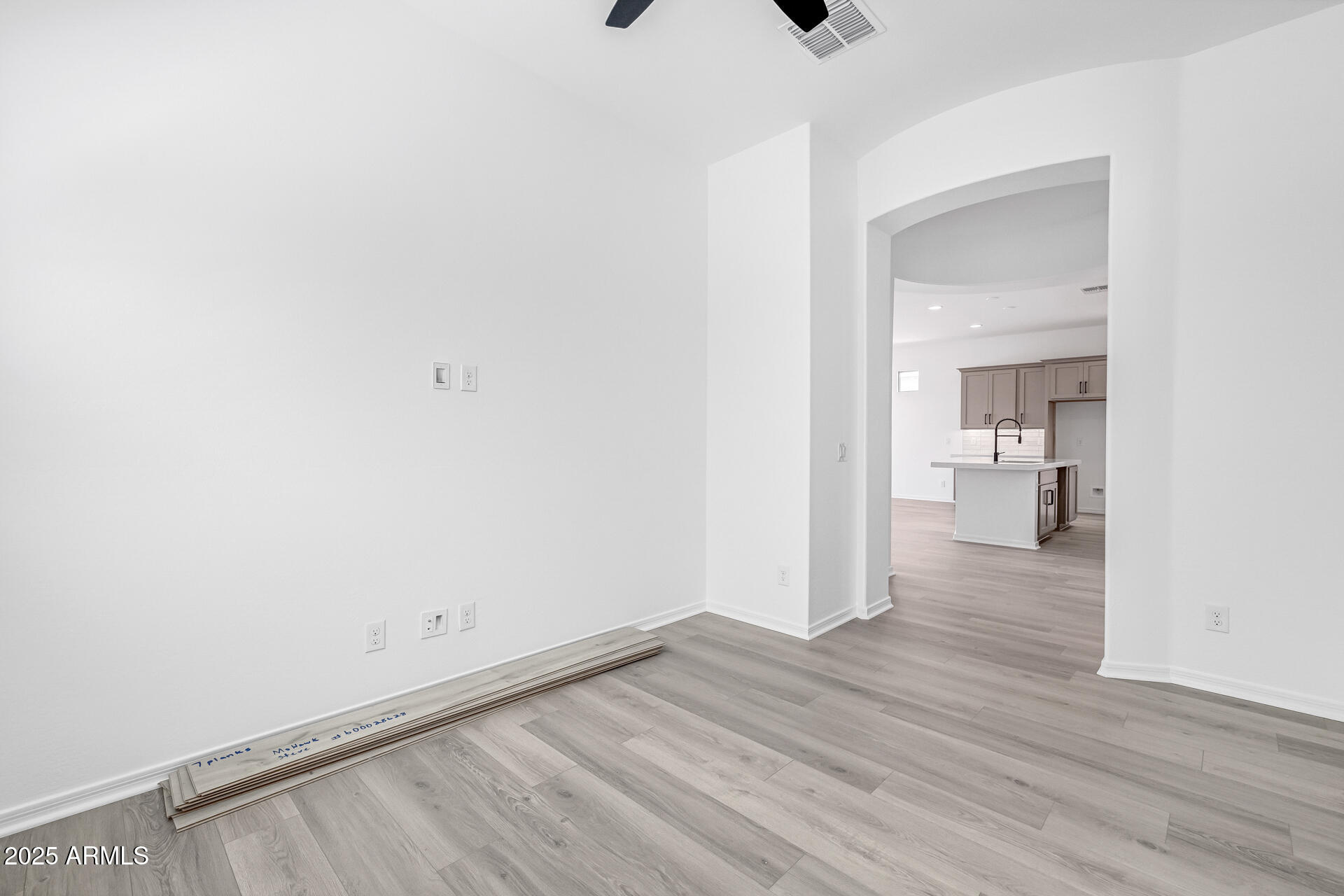 4252 East Bernice Street Gilbert, AZ 85295 - Photo 38 of 72 a view of a hallway with wooden floor and a bathroom