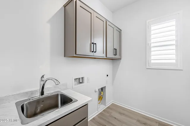 a front view of a house with a garden and garage