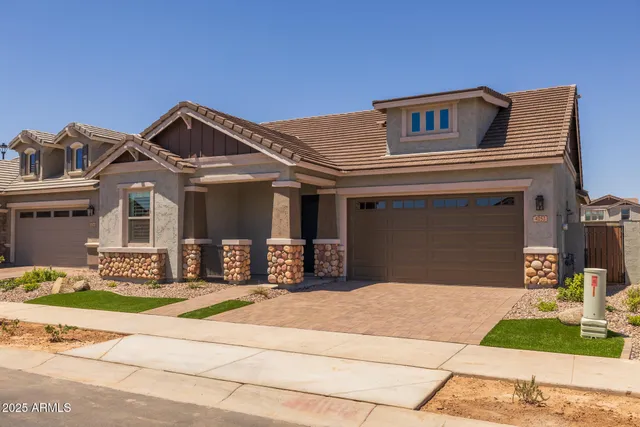 a living room with stainless steel appliances kitchen island furniture and a view of kitchen