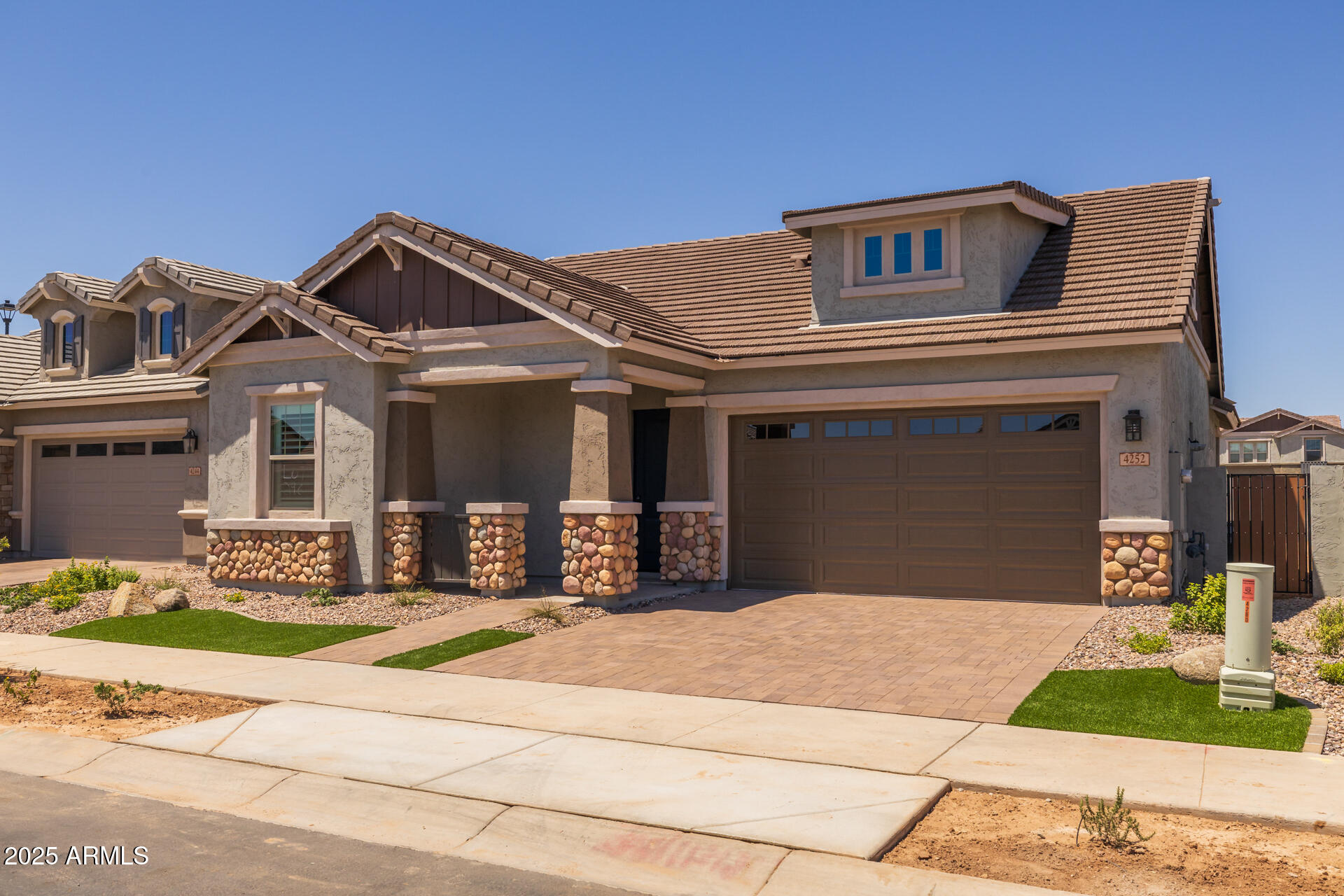 4252 East Bernice Street Gilbert, AZ 85295 - Photo 7 of 72 a front view of a house with a garden
