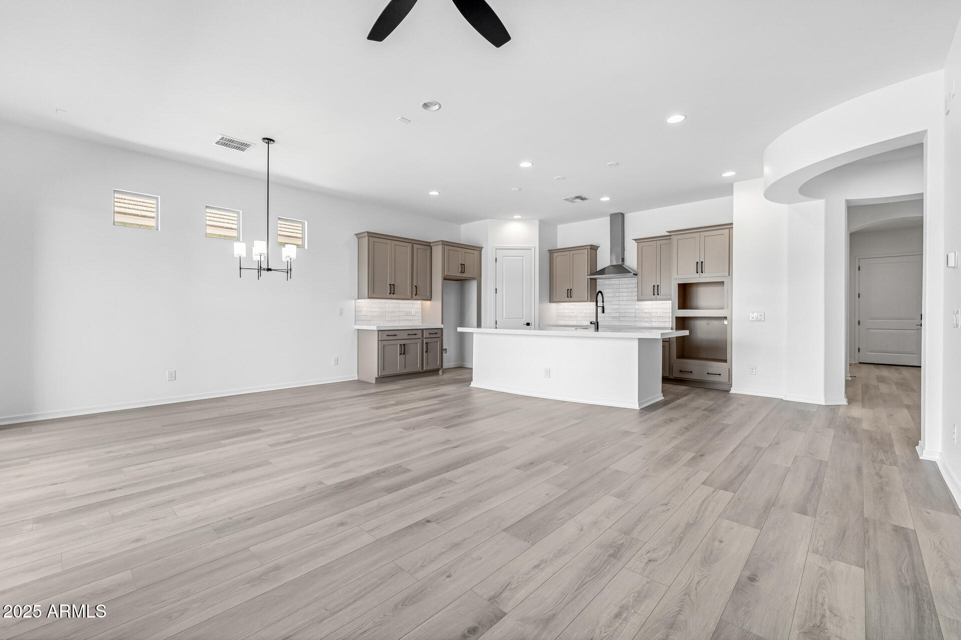 4252 East Bernice Street Gilbert, AZ 85295 - Photo 10 of 72 a view of a kitchen with wooden floor and a sink