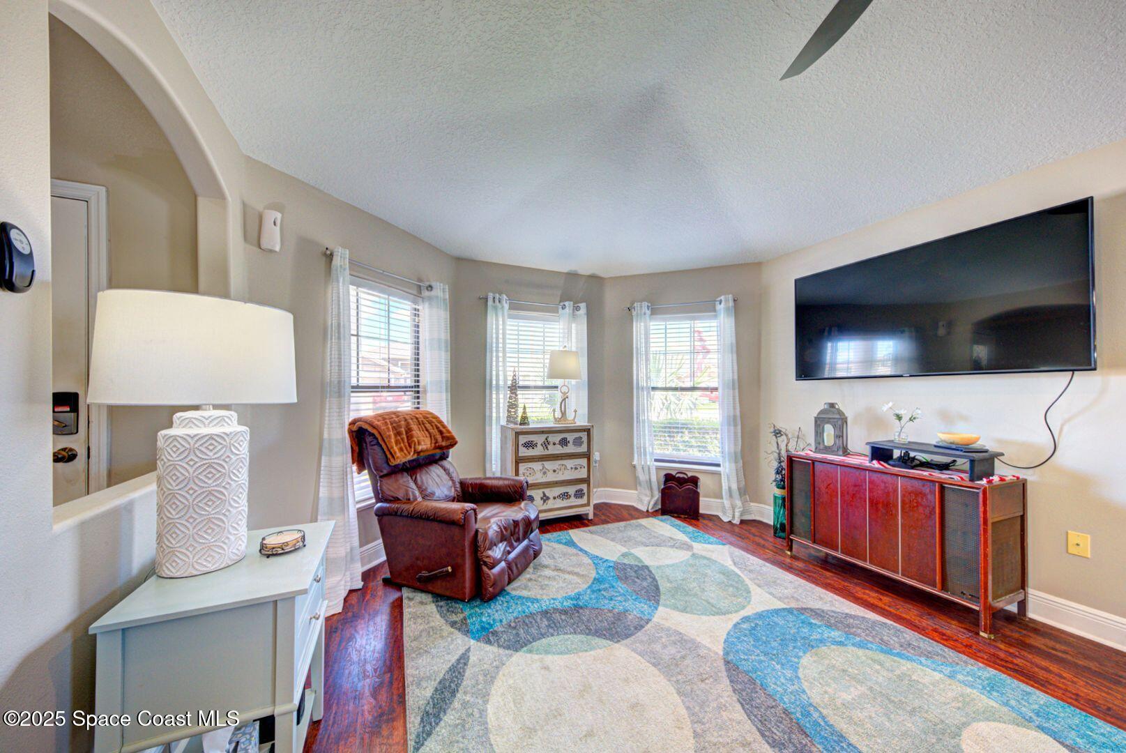 4082 Brantley Circle Rockledge, FL 32955 - Photo 12 of 31 a living room with furniture and a flat screen tv