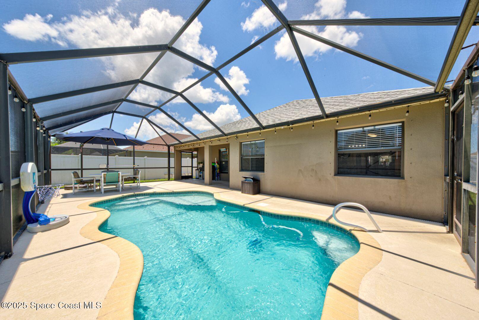 4082 Brantley Circle Rockledge, FL 32955 - Photo 28 of 31 Sparkling Screened Pool View 2